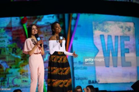 jenna on stage with a social activist on the WE event 